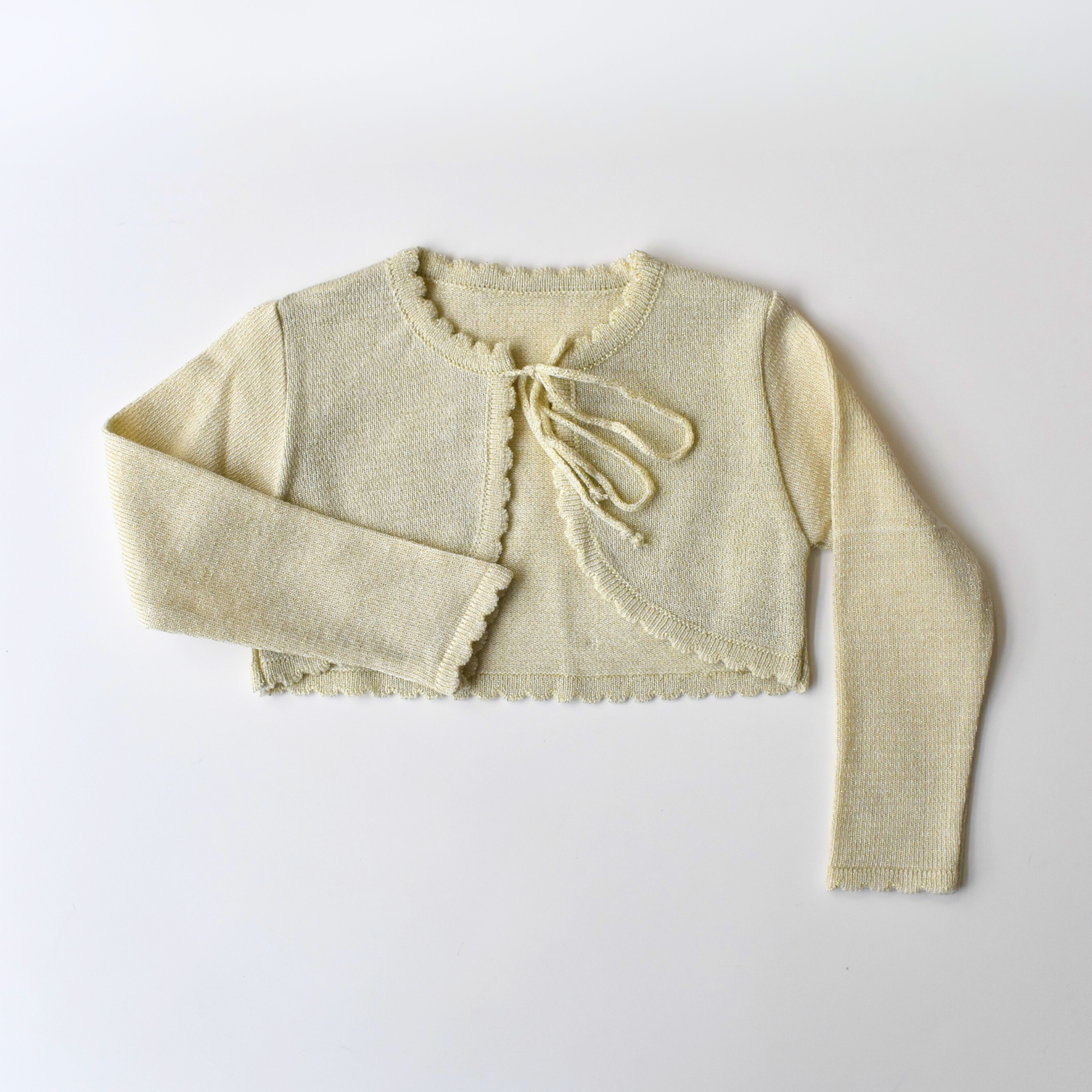 Light yellow knit cardigan with long sleeves and front tie closure