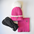 Three-piece kids’ winter set featuring a hot pink knit beanie with a fluffy white pom-pom, matching neck warmer, and black insulated mittens.